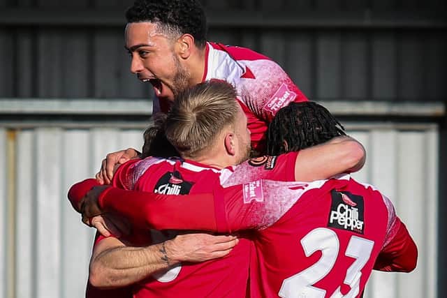 Eastbourne Borough players celebrate after the breakthrough against Slough | Picture: Andy Pelling