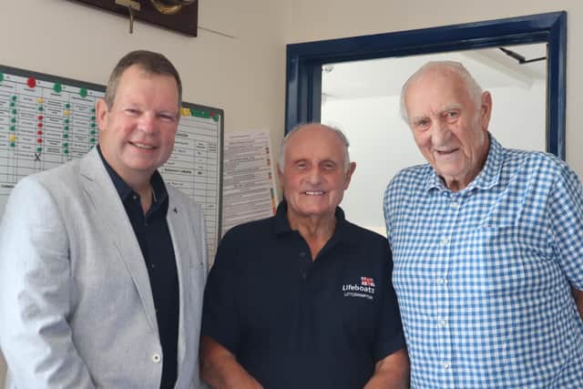 Geoff Warminger reunited with Mike McCartain and David Woollen to receive his 50 year medal