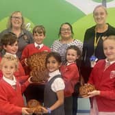 School children with Alison Whitburn and the harvest loaves