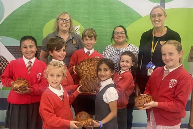 School children with Alison Whitburn and the harvest loaves