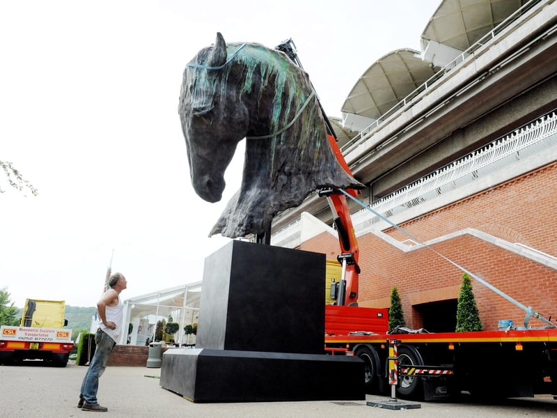 Nic Fiddian Green watches as the sculpture is lifted into place in July 2012