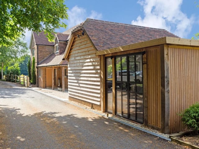 The property has a large garage and store and a home office