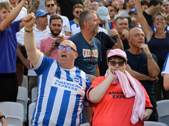 LONDON, ENGLAND - AUGUST 21: Fans of Brighton & Hove Albion celebrates their side's win after the final whistle of the Premier League match between West Ham United and Brighton & Hove Albion at London Stadium on August 21, 2022 in London, England. (Photo by Mike Hewitt/Getty Images)