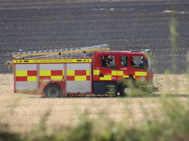 Firefighters successfully extinguished a fire in a field at Upwaltham, close to the A285. Photo: Jack Chiverton