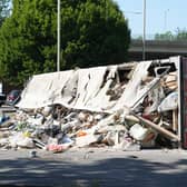 An articulated lorry came to rest on its side on the A23 London Road at the Mill Road roundabout, beside a BP petrol station. Photo: Eddie Mitchell