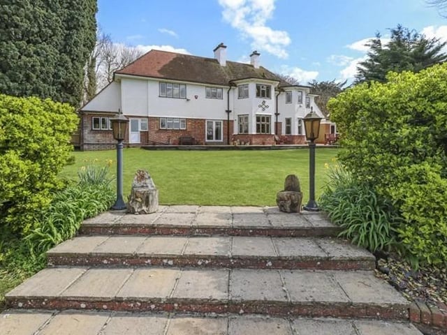 The rear the patio is approximately 60ft in width and is a real sun trap. The gardens are split into several well maintained and thought-out areas, the main area is level being mainly laid to lawn, with steps leading down to the 40ft by 18ft swimming pool with paved seating area and covered pool boiler room. A private wooded area and wild garden is located at the foot of the garden.