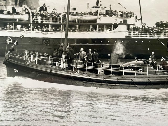On Tuesday 7 July 1931 Prince George visited Newhaven to christen the ‘Cecil and Lilian Philpott’, the first lifeboat of the late Mrs Lilian Philpott of London, a great benefactor to the RNLI. When loaded with crew, equipment and fuel the lifeboat weighed 20.5 tons. Fitted with an iron keel 9inch deep and 12inch broad, weighing 3 tons. Stern post in oak, grown to shape with bent Canadian elm timbers, self-draining cockpit, two 40hp engines, speed 8.25 knots, range at full speed of 110 miles, consumption 104 gallons, or 7.5 knot cruising speed range of 158 miles. On this date, Newhaven Lifeboat had been launched on service 171 times and rescued 317 lives. Prince George had to make three attempts to break the bottle of champagne over the bow of the vessel. Prince George then stepped aboard the lifeboat and the boat was launched. It cruised up and down the harbour and eventually ran alongside SS Worthing, where HRH went on board for tea.