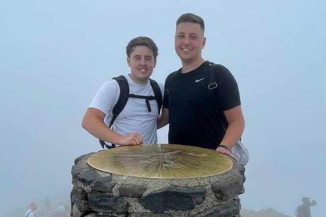 Friends George Collett and Frazer Burgess at the top of Yr Wyddfa (Snowdon) in 2022