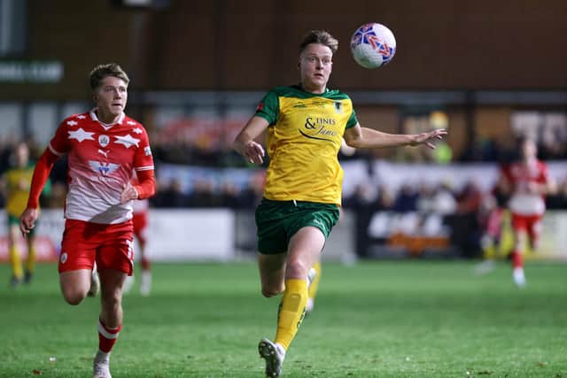 HORSHAM, ENGLAND - NOVEMBER 14: Jack Strange of Horsham chases the ball whilst under pressure from Aiden Marsh of Barnsley during the Emirates FA Cup First Round Replay match between Horsham and Barnsley at The Camping World Community Stadium on November 14, 2023 in Horsham, England. (Photo by Charlie Crowhurst/Getty Images)