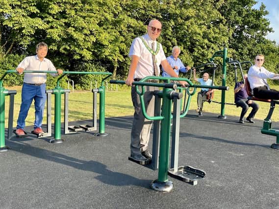 Cllrs using the new gym equipment