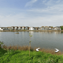 Police are investigating after a man was reportedly hit in the leg by a projectile or BB gun pellet while sitting by a pond in Southbourne. Photo: Google Earth.