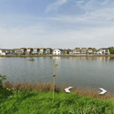 Police are investigating after a man was reportedly hit in the leg by a projectile or BB gun pellet while sitting by a pond in Southbourne. Photo: Google Earth.