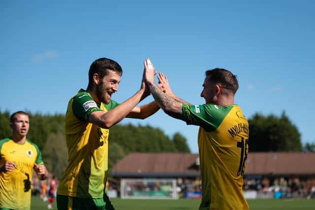 Reece Myles-Meekums (right) is congratulated by Ashley Nadesan after netting against Dagenham & Redbridge. Picture by McCartney Martin