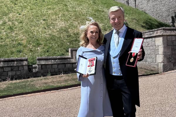 Dame Jayne Torvill and Sir Christopher Dean receiving their honours at Windsor castle in June. Dean was wearing a Dobell suit. Photo: contributed