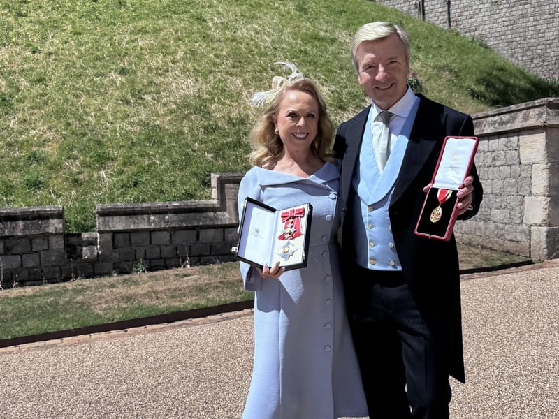 Dame Jayne Torvill and Sir Christopher Dean receiving their honours at Windsor castle in June. Dean was wearing a Dobell suit. Photo: contributed