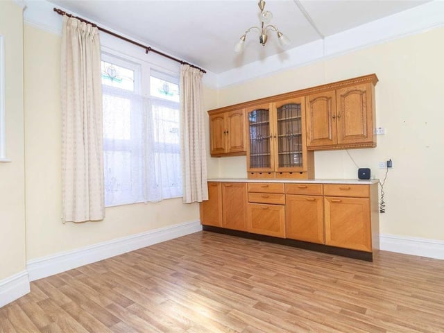 There is a built-in dresser with space for table and chairs