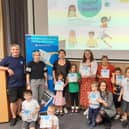 High Sheriff of West Sussex, Andy Bliss, with Hannah Dow, digital safety delivery officer at West Sussex County Council, Mat Hasker, global web director at Get Safe Online, parents and children at the Digital Stories launch event at Worthing Library