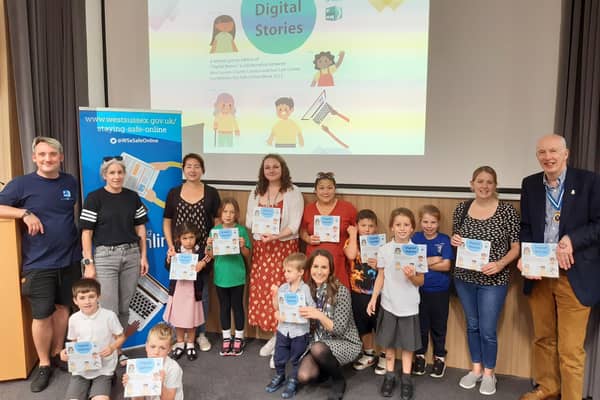 High Sheriff of West Sussex, Andy Bliss, with Hannah Dow, digital safety delivery officer at West Sussex County Council, Mat Hasker, global web director at Get Safe Online, parents and children at the Digital Stories launch event at Worthing Library