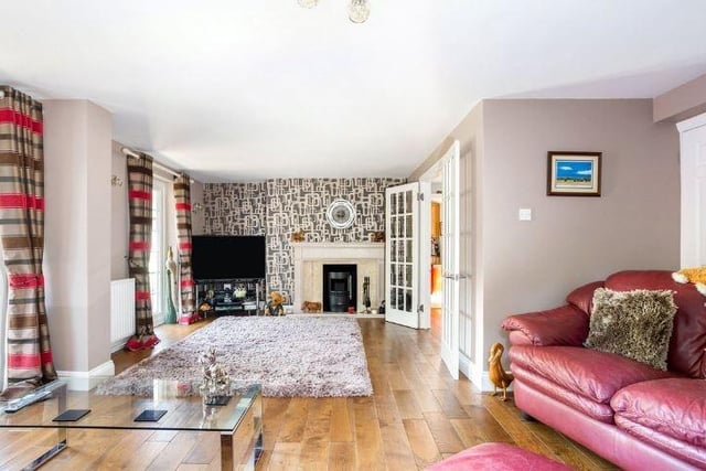 The property's excellent living spaces include a dual-aspect aspect sitting room