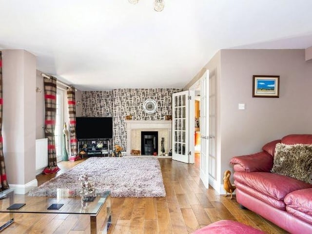 The property's excellent living spaces include a dual-aspect aspect sitting room
