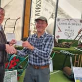 Derek Swaine (left) presents the cheque to Clive Gravett at the Museum of Gardening in Hassocks
