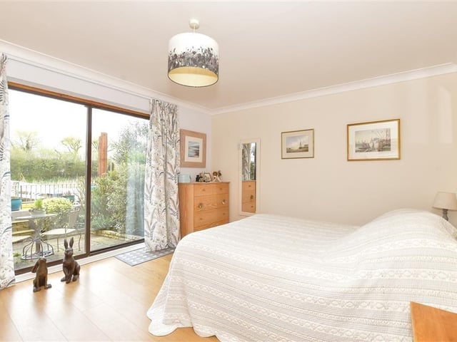 This modern town house with waterside garden is tucked away on a desirable private development in the heart of Arundel. It comes to the market with Cubitt & West, priced at £700,000.