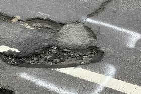 One of the many deep potholes in St Leonard's Road, Horsham