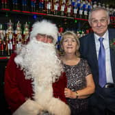 Ian and Maureen Holt from Burgess Hill married 53 years ago and renewed their vows with Father Christmas at the new grotto at South Downs Heritage Centre, Hassocks. Photo: Archie Tipple