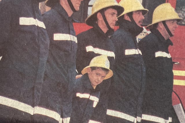 Seven-year-old Philip Swan with fire crews.