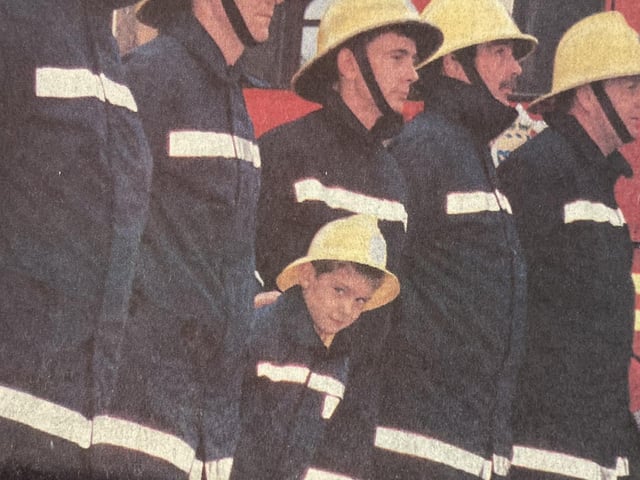 Seven-year-old Philip Swan with fire crews.