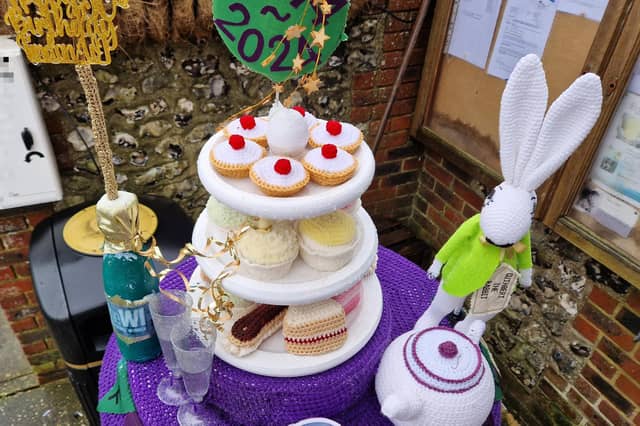 A stunning afternoon tea made from crochet has been formed into a post box topper to celebrate the 50th anniversary of Findon Village WI