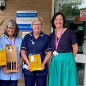 Midhurst Macmillan nurses showcase some raffle prizes