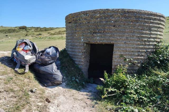 Rubbish being removed from a pill box in Cuckmere Haven. Photo: Laura Clapham