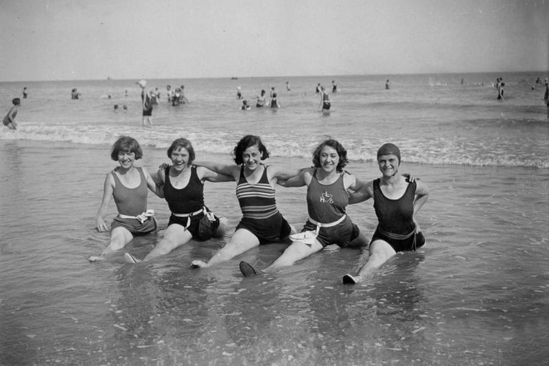 Five happy bathers doing the 'splits' in the sea at Eastbourne on 9th August 1930.
