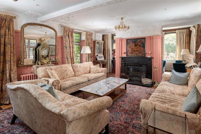A generous drawing room panelled in sycamore with ornamental plaster friezes on all four walls depicting mythical birds, plants and trees. This room also features like the reception room a chequered wooden floor and a handsome fireplace flanked by ornamental pallasters.