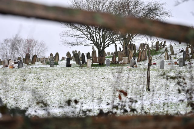 The village churchyard in Wisborough Green proved a chilly spot this morning.  Pic S Robards SR2303082