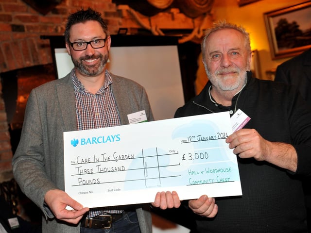 Judge Steve Young presents a cheque for £3,000 to Care in the Garden CIC