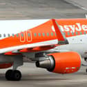 Police officers met an easyJet flight at Gatwick Airport. (Photo by Dan Kitwood/Getty Images)