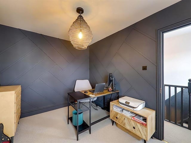 Bedroom four, with feature panelled walls and skirting, could be used as an office