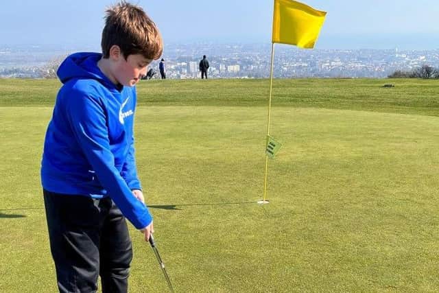 Junior golfer tries out Eastbourne Downs Golf Course
