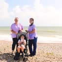 Care staff from Chestnut Tree House help Sam enjoy a day at the beach