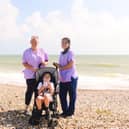 Care staff from Chestnut Tree House help Sam enjoy a day at the beach
