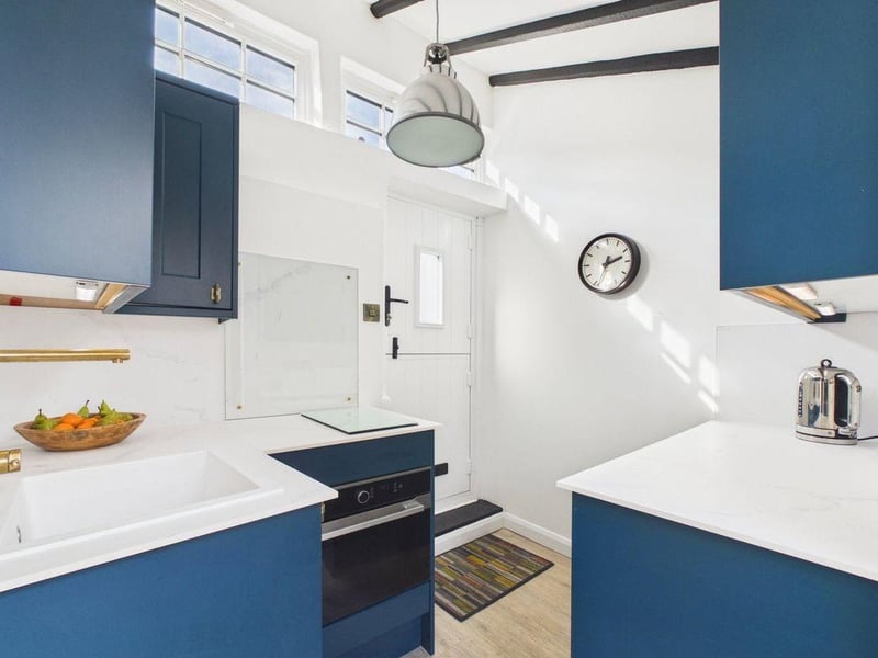 The double-glazed front door opens directly into the kitchen