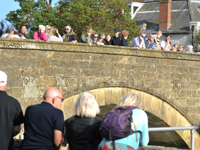 Crowds gather ahead of the Arundel RNLI Duck Race on Bank Holiday Monday.