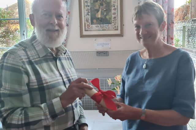 Cliff Archer being presented with Freedom of the Parish by Jane Towers, Vice Chair of the Parish Council.