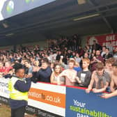 Crawley Town fans celebrate after the 0-0 draw with Walsall