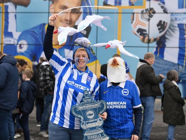 BRIGHTON, ENGLAND - MARCH 19: Fans pose for a photo as they arrive outside the stadium prior to the Emirates FA Cup Quarter Final match between Brighton & Hove Albion and Grimsby Town at Amex Stadium on March 19, 2023 in Brighton, England. (Photo by Mike Hewitt/Getty Images)