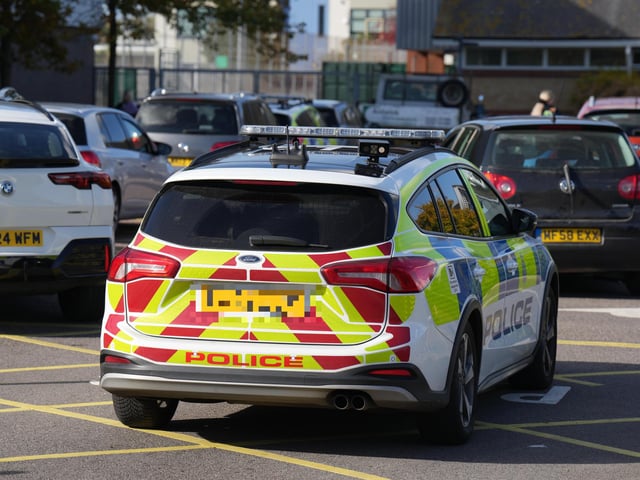 Police officers on hunt for man with suspected firearm