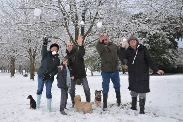 Snow fun in Gildredge Park (L-R : Liz Johnson, James and Patrick McCurry, Mark and Alison Naughton)