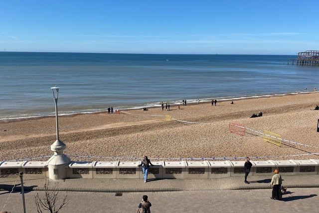Police officers have taped off a section of Brighton beach after the discovery of a 'suspected mine'